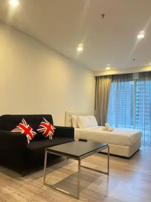 a living room with a couch and a coffee table at One Bukit Ceylon At Pavilion Bukit Bintang in Kuala Lumpur