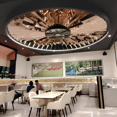 a dining room with a ceiling with a chandelier at Platinum 2 KLCC By Natol Chain Of Homestays in Kuala Lumpur