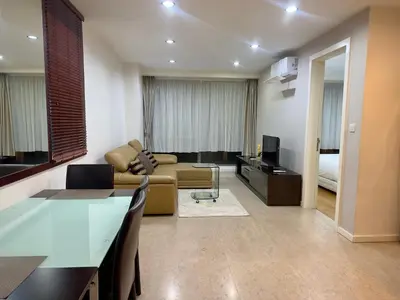 a living room with a couch and a television at Bukit Bintang Fairlane KLCC suites by Angel in Kuala Lumpur
