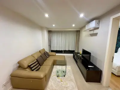 a living room with a couch and a television at Bukit Bintang Fairlane KLCC suites by Angel in Kuala Lumpur