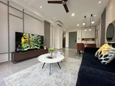 a living room with a couch and a tv and a table at Agile Bukit Bintang by Romeo Bnb in Kuala Lumpur