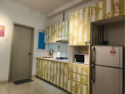a kitchen with a refrigerator and a microwave at VR3 Sunway Velocity Spacious Apt\u4e2d\u6587\u623f\u6771 in Kuala Lumpur