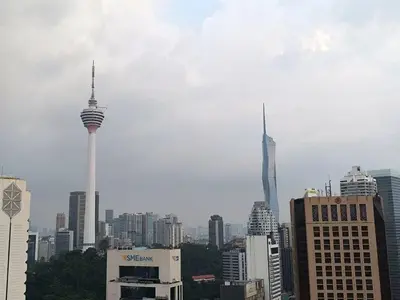 a view of a city with two tall buildings at Alaman Luxe suites KLCC in Kuala Lumpur