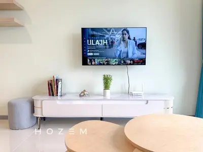 a white desk with a tv on a wall at 3BR3B Hozem KL4523 Apartment Segambut in Kuala Lumpur