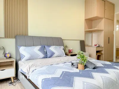 a bedroom with a bed with a potted plant on it at 3BR3B Hozem KL4523 Apartment Segambut in Kuala Lumpur