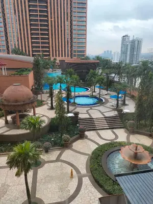 an aerial view of a park with two pools at Times Square Suite KL in Kuala Lumpur
