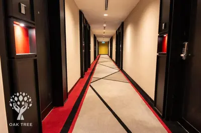 a hallway with a red carpet and a long corridor at Menara M101 Dang Wangi Kuala Lumpur in Kuala Lumpur