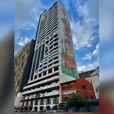 a tall building with a mural on the side of it at Menara M101 Dang Wangi Kuala Lumpur in Kuala Lumpur