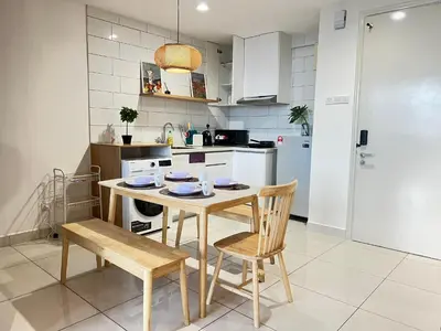 a kitchen with a table and two chairs and a table at Arte Mont Kiara By Luxe Home in Kuala Lumpur