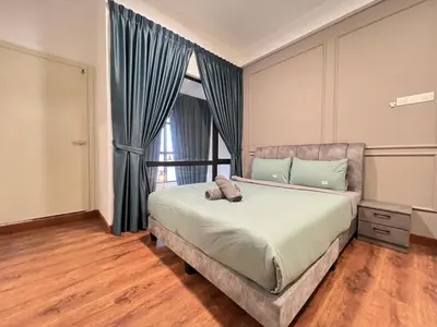a bedroom with a bed with blue curtains and a window at Arte Mont Kiara By Luxe Home in Kuala Lumpur