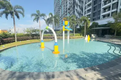 a pool with a water park in a city at Comfy studio suite Free Parking Netflix Trion C3208St KL in Kuala Lumpur