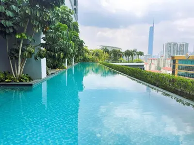a large blue swimming pool on top of a building at Comfy studio suite Free Parking Netflix Trion C3208St KL in Kuala Lumpur