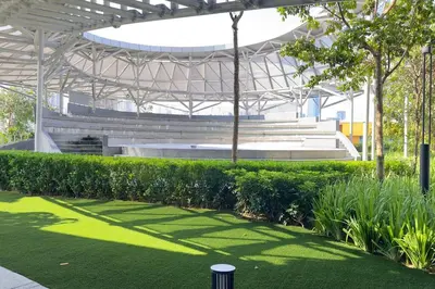 a stadium with a green grass field and benches at Comfy studio suite Free Parking Netflix Trion C3208St KL in Kuala Lumpur