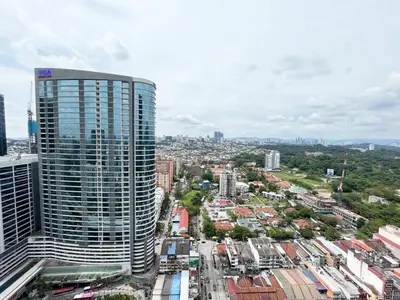 an aerial view of a city with a tall building at Scenic Garden Balcony EST Bangsar Studio for 2 in Kuala Lumpur