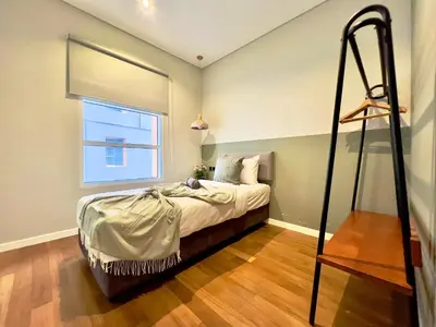a bedroom with a bed and a window at Sky Suites Chill 3BR Suite at KLCC in Kuala Lumpur