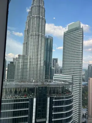 a view of a large city with tall buildings at Sky Suites KLCC by ARBA in Kuala Lumpur