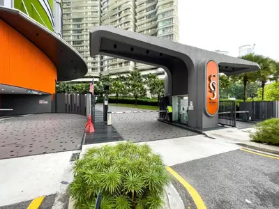 a building with an orange sign on it at Sky Suites KLCC by ARBA in Kuala Lumpur