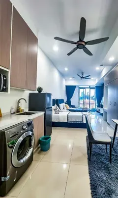 a kitchen with a washer and dryer in a room at Taragon Bukit Bintang in Kuala Lumpur