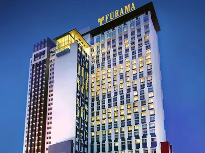 a tall building with a hotel sign on top of it at Taragon Bukit Bintang in Kuala Lumpur