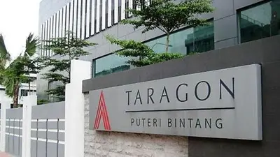 a sign for the taragon united building in front of a building at Taragon Bukit Bintang in Kuala Lumpur