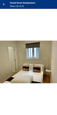 a bedroom with two beds and a window at Travel INN Bukitbintang in Kuala Lumpur
