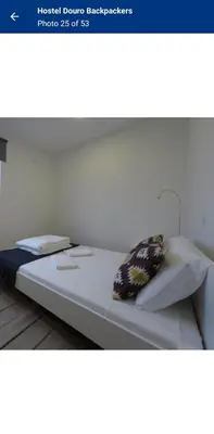 a large bed in a bedroom with at Travel INN Bukitbintang in Kuala Lumpur