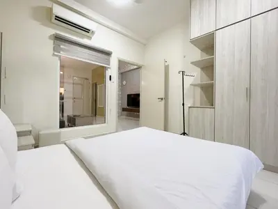 a white bedroom with a white bed and a window at Arte mont kiara by Happy stay in Kuala Lumpur