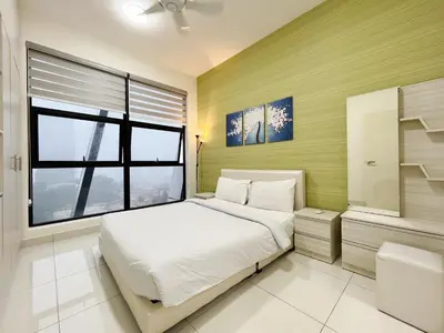 a bedroom with a white bed and a window at Arte mont kiara by Happy stay in Kuala Lumpur