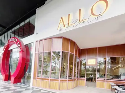 a store front of a mall with a large red sign at Arte mont kiara by Happy stay in Kuala Lumpur