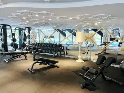 a gym with a lot of treadmills and weights at Arte mont kiara by Happy stay in Kuala Lumpur