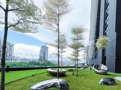 a park with trees in a city with buildings at Arte mont kiara by Happy stay in Kuala Lumpur
