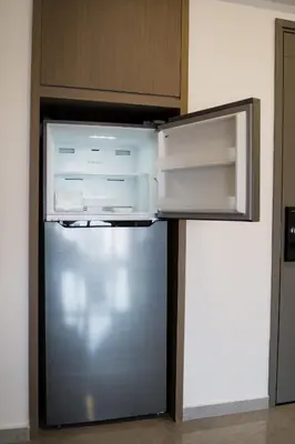 a refrigerator with its door open in a kitchen at Agile BB Residence Pavilion TRX by GB in Kuala Lumpur
