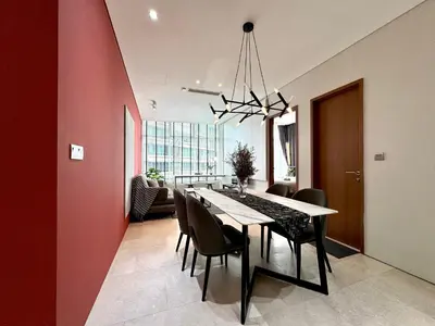 a dining room with a dining table and chairs at Sky Suites Lovely 3BR Suite at KLCC in Kuala Lumpur