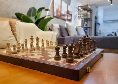 a chess board on a table in a living room at COL 14A Modern Infinity Pool KLCC View with Balcony in Kuala Lumpur