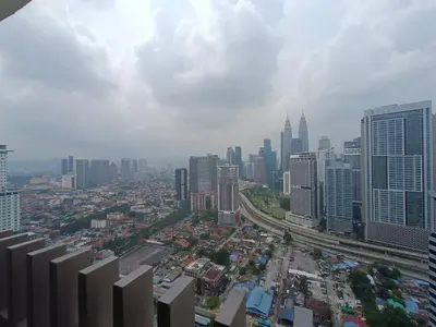 an aerial view of a city with tall buildings at COL 27A KLCC View Infinity Pool View in Kuala Lumpur