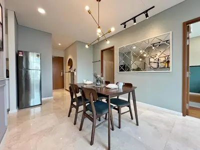 a dining room with a table and chairs at Sky Suites Leisure 3BR Suite at KLCC in Kuala Lumpur