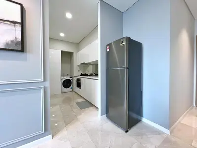 a large stainless steel refrigerator in a kitchen at Sky Suites Leisure 3BR Suite at KLCC in Kuala Lumpur