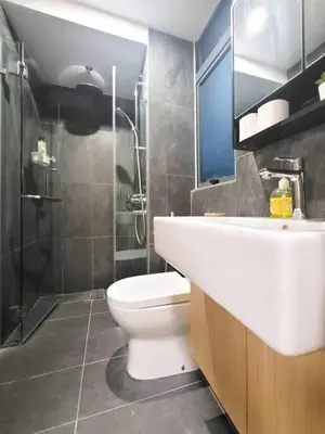 a bathroom with a toilet and a shower and a sink at COL 915A Modern Duplex Studio KLCC in Kuala Lumpur