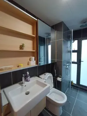 a bathroom with a sink and a toilet and a shower at COL 915B Studio Balcony Infinity Pool KLCC View in Kuala Lumpur