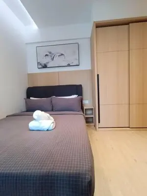 a bedroom with a bed and a large closet at COL 915B Studio Balcony Infinity Pool KLCC View in Kuala Lumpur