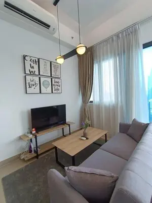 a living room with a couch and a table at COL 30A Super Balcony KLCC KL Tower View in Kuala Lumpur