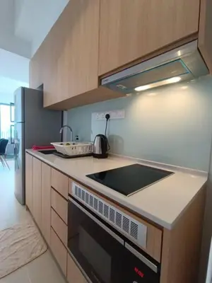 a kitchen with a sink and a stove top oven at COL 30A Super Balcony KLCC KL Tower View in Kuala Lumpur