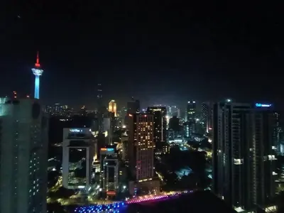 a view of a city skyline at night at COL 30B KL Tower View Cozy Studio in Kuala Lumpur