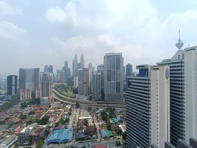 an aerial view of a city with tall buildings at COL 23aA Cozy KLCC View & Infinity Pool Studio in Kuala Lumpur