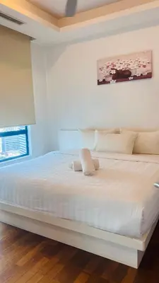 a white bedroom with a large white bed at KL Homestay at Casa Residency- Walk to Lalaport & LRT in Kuala Lumpur