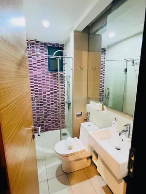 a bathroom with a sink and a toilet and a mirror at KL Homestay at Casa Residency- Walk to Lalaport & LRT in Kuala Lumpur
