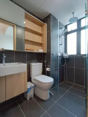 a bathroom with a toilet and a sink and a shower at COL 93A 2Queen bed Balcony KLCC View Family Suites in Kuala Lumpur