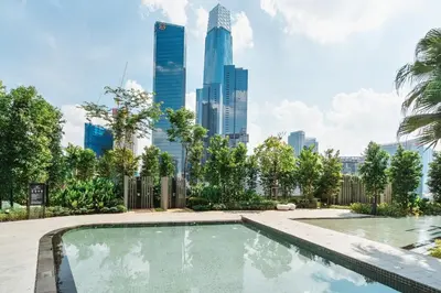 a swimming pool with a city skyline in the background at Japandi 1BR Agile Bukit Bintang by RumaBnB in Kuala Lumpur