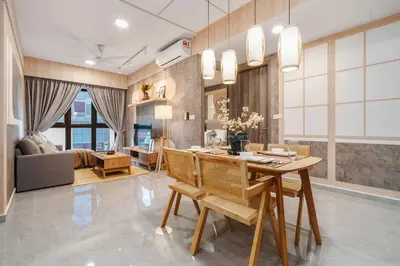 a dining room and living room with a table and chairs at Japandi 1BR Agile Bukit Bintang by RumaBnB in Kuala Lumpur