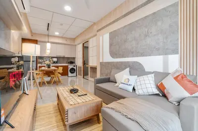 a living room with a couch and a table at Japandi 1BR Agile Bukit Bintang by RumaBnB in Kuala Lumpur